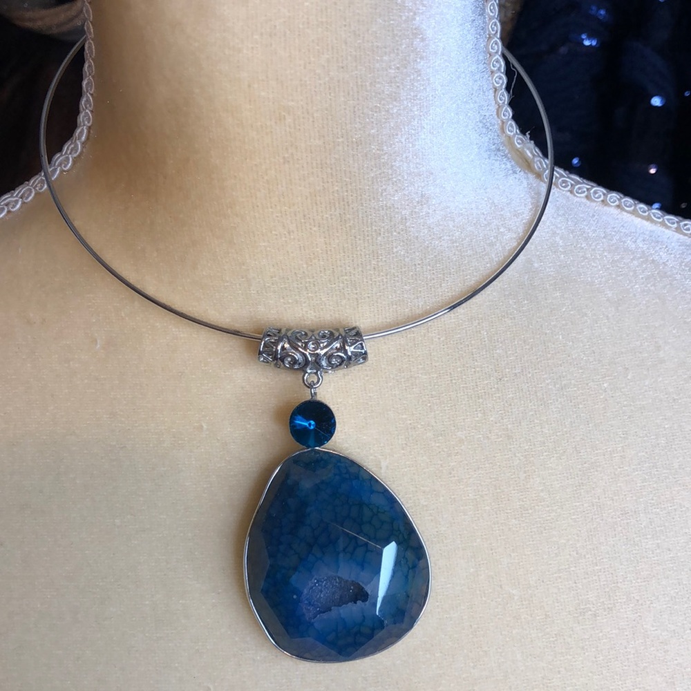 Silver necklace with blue stone pendant